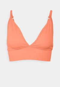 Bralette cor-de-rosa coral feito de tecido canelado, apresentando um decote em V profundo, alças finas ajustáveis e uma faixa de suporte.