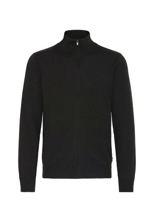 Pull noir zippé avec un col montant et une texture côtelée, présenté de face sur un fond uni.