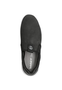Black slip-on shoe with a smooth upper, textured collar, white outsole, and Timberland logo on the side. Interior features cushioned footbed.