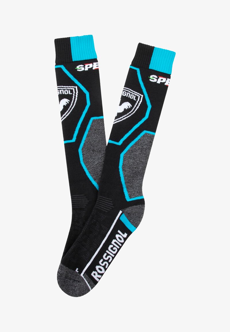 Calcetines de esquí en negro y gris con un patrón hexagonal, detalles en azul verdoso y la marca "ROSSIGNOL". Plantilla reforzada y puños acanalados.