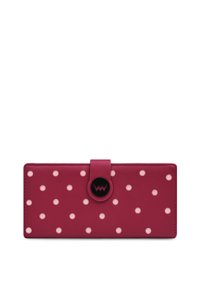 Fuchsia wallet featuring white polka dots, a magnetic closure, and a round logo accent. Made of smooth synthetic material.