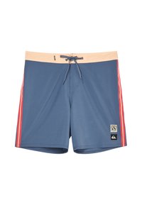 Blue swim shorts with beige waistband, red and pink side stripes, front drawstring, and two small black and white logo patches on the left leg.