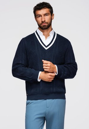 - Sweter