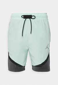 Mintgröna träningsshorts med svarta accenter. Har resårmidja med snörning och Jordan-logotyp på nederdelen fram. Texturerad svart sidpanel.