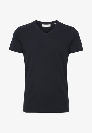 Majica kratkih rukava, V-izreza u tamnoplavoj boji. Izrađena od mekog pamuka, ima čist i jednostavan dizajn s regularnim krojem.