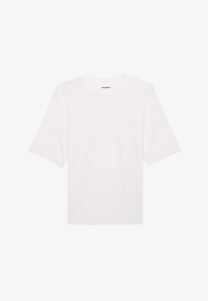 Balts īsām piedurknēm T-krekls ar apaļu kakla izgriezumu un pārāk lielu piegriezumu, izgatavots no mīksta auduma ar gludu tekstūru. Bez rakstiem vai grafikas.