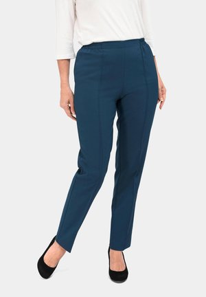 Navy stretchbroek met een gladde textuur, elastische tailleband en taps toelopende benen. Het ontwerp heeft voorste naden en geen zichtbare zakken.