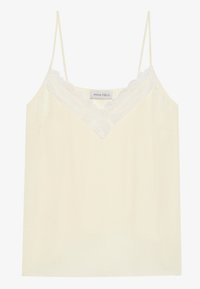 Camisole color crema con spalline sottili, bordino in pizzo lungo il décolleté e tessuto in cotone morbido. Presenta un'etichetta Anna Field all'interno.
