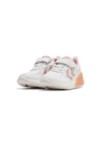 White athletic shoes with a textured surface, featuring a pink accent on the heel and a velcro strap over the laces.