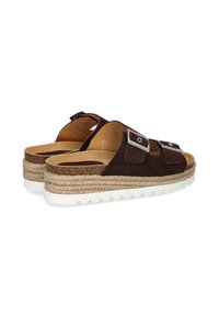 Brown suede sandals with two adjustable straps, natural jute midsole, and white rubber outsole. Features a textured finish and metallic accents.