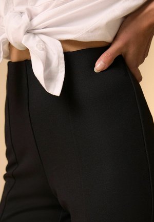 Next, REGULAR FIT - PONTE STIRRUP LEGGINGS - Leggings - Hosen - black