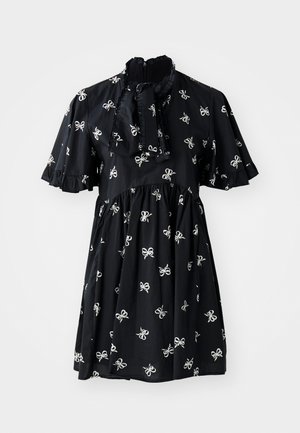 Black dress with short sleeves, featuring white bow patterns, ruffled accents, a high neckline, and a gathered waistline.