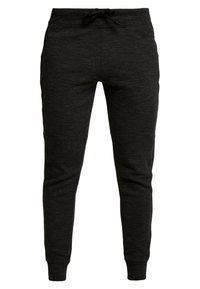 Schwarze Sweatpants aus einem weichen, strukturierten Stoff, mit elastischem Bund und Kordelzug sowie schmal zulaufenden Beinen mit elastischen Bündchen an den Knöcheln.