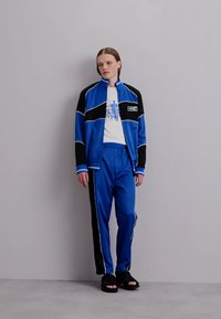 Alexandra Moura DUALITY TROUSERS - Donji dijelovi trenirke - sports blue