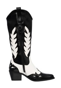 Botas de vaquero en blanco y negro con puntera puntiaguda, caña alta, recortes florales y cremallera lateral; hechas de cuero liso con tacón en bloque.