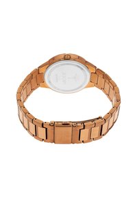 Roze gouden roestvrijstalen horloge met een schakelarmband, een ronde kast en een transparante achterkant die het uurwerk en het merklogo toont.