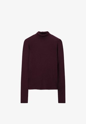 Burgundy long-sleeve turtleneck top made of soft, stretchy fabric with a fitted design and minimal seams, suitable for layering.