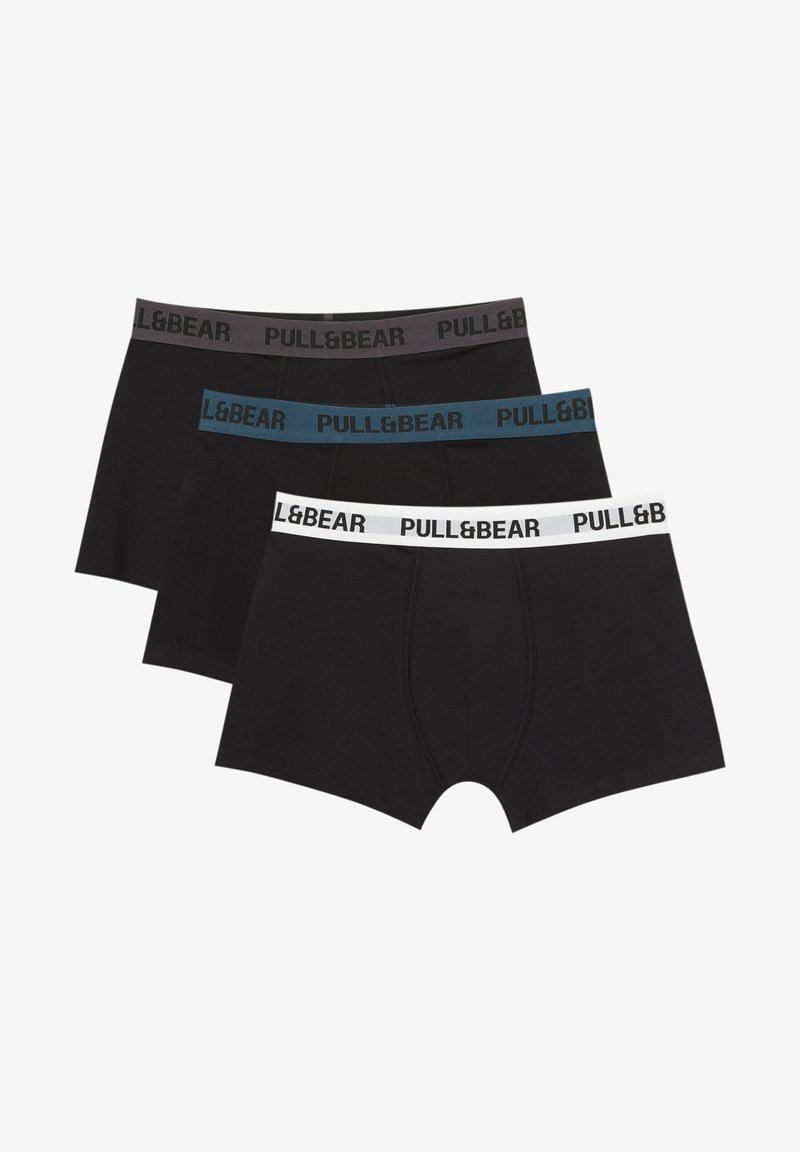 Ensemble de trois boxers noirs. Ceintures élastiques en noir, bleu sarcelle et blanc avec le logo "PULL&BEAR". Tissu en coton doux, design sans coutures.