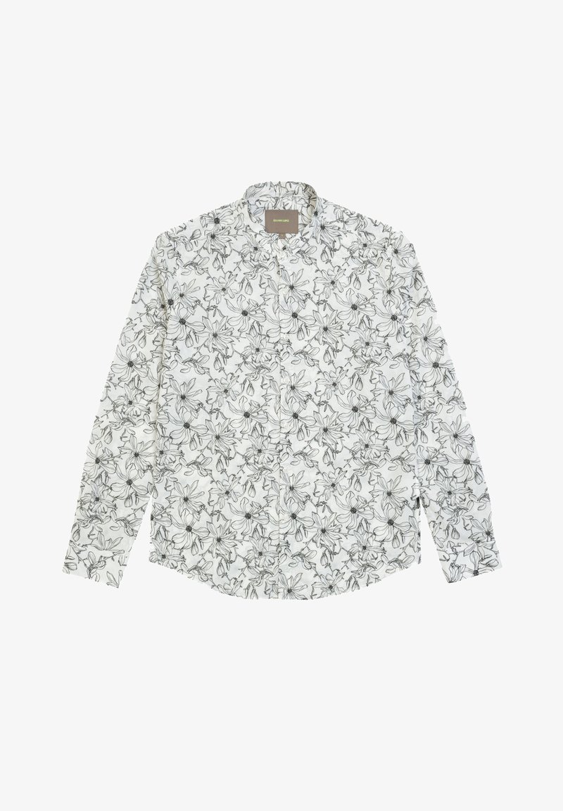 Camicia bianca a maniche lunghe con un motivo floreale nero. Il tessuto è leggero, con colletto classico e chiusura frontale con bottoni.