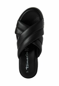 Sandalia deslizante de cuero negro con diseño de tiras entrecruzadas. Textura suave y lisa con una plantilla de marca y suela de perfil bajo. Talla 37.