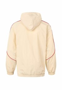 Lysebeige hættejakke med elastiske manchetter, med røde kanter langs skuldrene og ryggen. Glat tekstur, afslappet design.