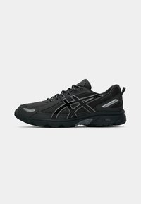 Black athletic shoes with a textured fabric upper, reflective silver accents, and a rubber outsole, featuring GEL cushioning technology.