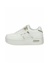 White low-top sneaker with thick sole, perforated side panel, gold-tone eyelets, and "Replay" logo on the sole’s outer side.