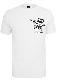 White T-shirt with short sleeves featuring black graffiti-style text "BAD BOY" and "NEW YORK" near the chest. Cotton material.