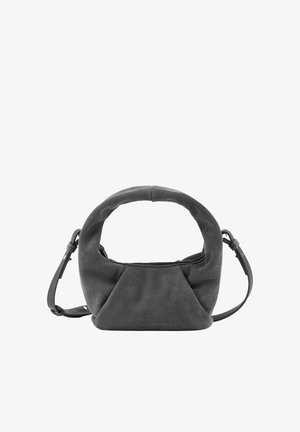 Weiche schwarze Wildlederhandtasche mit rundem Griff und verstellbarem Schultergurt, minimalistisches Design und subtile Struktur auf schlichtem weißen Hintergrund.