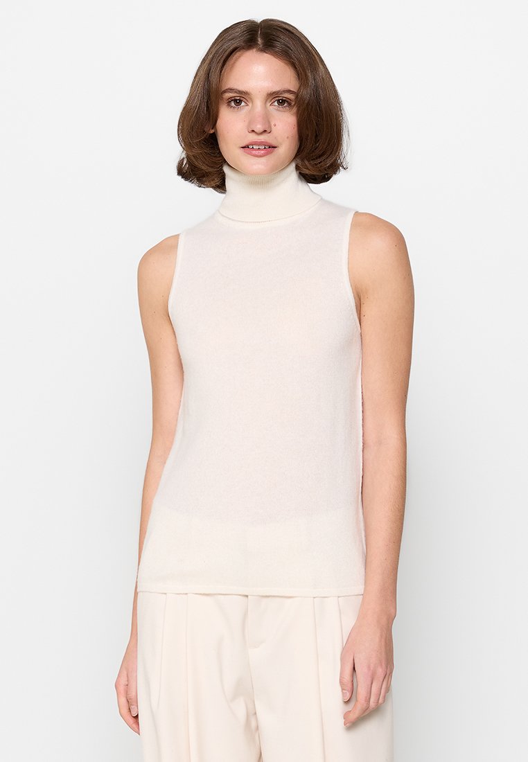Hihaton, vaalean kerma turtleneck-toppi, joka on valmistettu pehmeästä neulekankaasta. Siinä on mukautuva muotoilu ja hienovarainen rakenne, suora helma.
