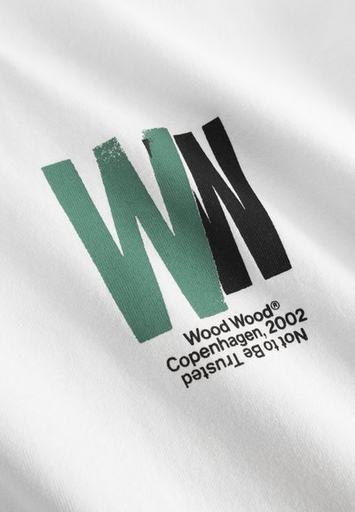 White fabric featuring a bold graphic design with the letters "WN" in green and black. Includes the text "Wood Wood® Copenhagen, 2002."