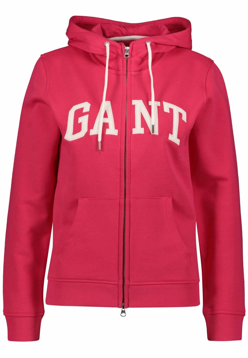 Roze hoodie met ritssluiting en een capuchon, witte trekkoorden en het 'GANT' logo in dikke letters. Beschikt over voorkruiken en geribbelde manchetten. Zachte stoftextuur.