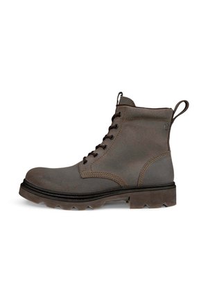 Grau geschnürter Knöchelstiefel mit klobiger Sohle, Zuglaschen an Zunge und Ferse sowie kontrastierenden Nähten an den Seiten.