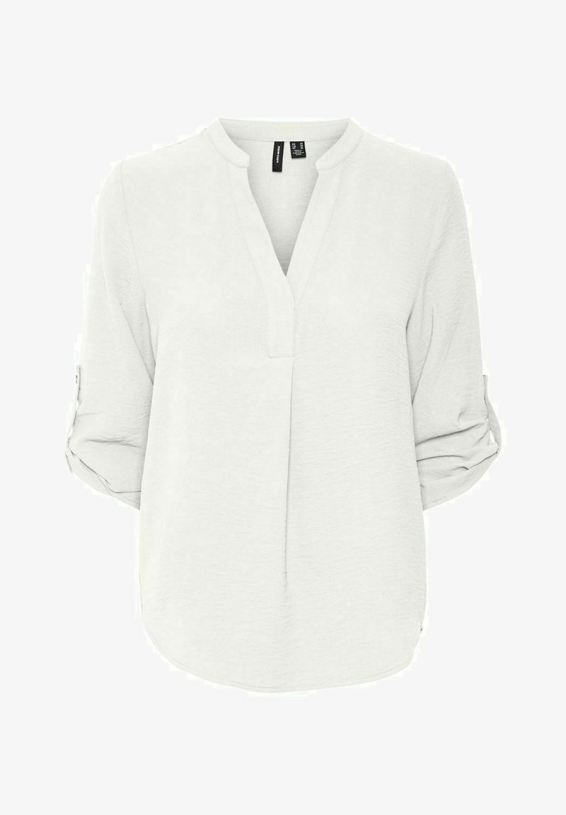 Vaaleanharmaa, kevyt blouson, jossa on V-pääntie, kolme neljännesosapituista hihoja, jotka on kääritty ylöspäin, ja hieman kaareva helma. Materiaali on pehmeää ja tekstuurista.