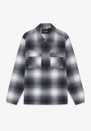 Schwarz-weiße Karoviskose aus Stoff mit strukturierter Oberfläche. Mit Kragen, zwei Brusttaschen und besticktem Markenlogo.