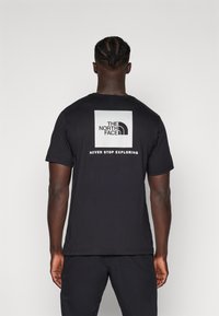 The North Face REFLECTIVE BOX TEE - Sports T-shirt - black