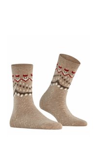 Calze alla caviglia in maglia beige con motivo rosso e bianco. Presentano una fascia texturizzata e accenti decorativi attorno alla caviglia.