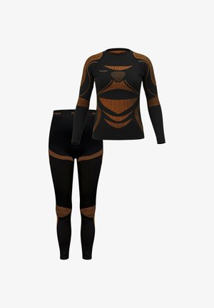 Schwarzes Thermal-Langarmshirt und Leggings mit orangen Akzentlinien und Mesh-Einsätzen. Eng anliegendes Design mit gerippter Textur, ideal zum Schichten.
