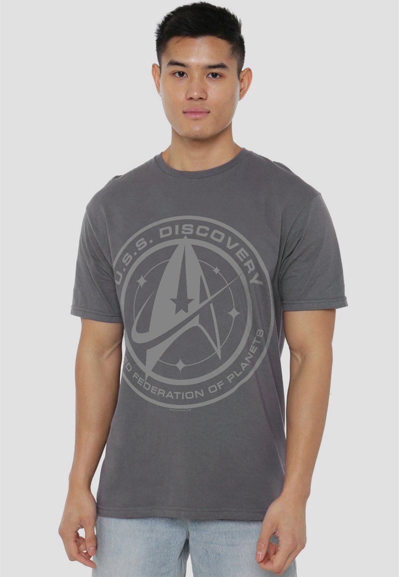 Gray cotton t-shirt featuring a central graphic of the U.S.S. Discovery emblem with text, short sleeves, and a standard fit.