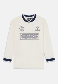 Lange mouw crèmekleurig jersey met marineblauwe accenten. Voorzien van een geweven zigzagpatroon, logoprints en een ronde halslijn.