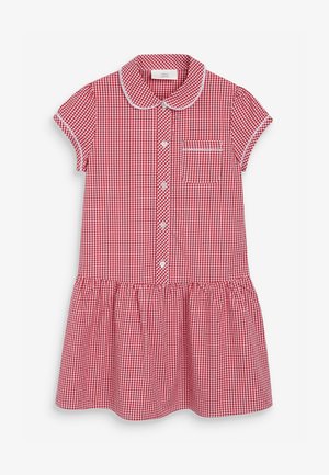 Robe vichy rouge avec un col, des manches courtes, des boutons sur le devant et une jupe froncée. Présente une petite poche poitrine avec un bord.