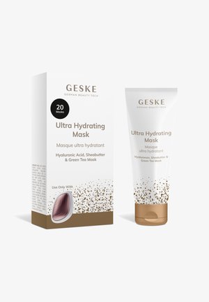 Geske Ultra Hydrating Mask tube og æske med hyaluronsyre, sheasmør og grøn te, med guldpletteret design på hvid baggrund.