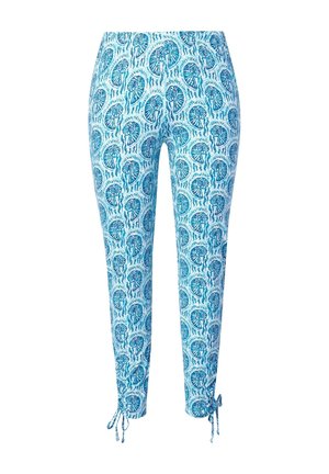 Slim fit -housut sinisellä simpukkakuvioinnilla, nilkkaan ulottuvat, säädettävillä nauhoilla helmassa, vaaleansininen tausta.