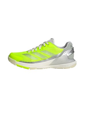 Bright neon yellow athletic shoe with silver accents, mesh upper, textured design, and a lightweight sole. Features lacing system and supportive heel.