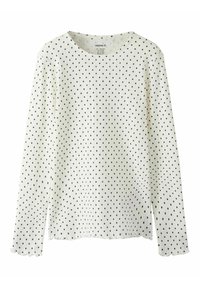 Hvid langærmet top lavet af struktureret stof med sorte polkaprikker. Har rund halsudskæring og bølgede manchetter. Enkel design.