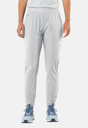 Lichtgrijze sportbroek met een elastische tailleband, ritszakken en een tapered design. Gemaakt van een gladde, lichte stof.