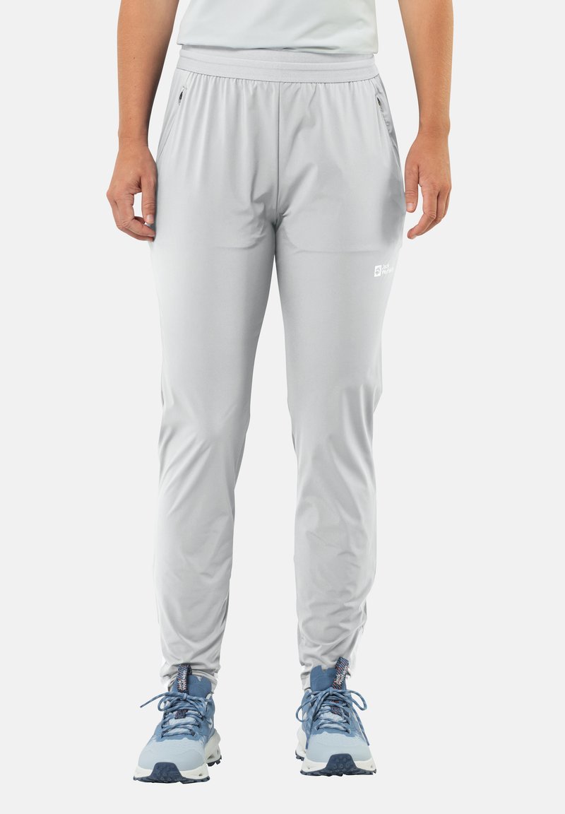 Lichtgrijze sportbroek met een elastische tailleband, ritszakken en een tapered design. Gemaakt van een gladde, lichte stof.