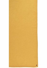 Écharpe en tricot de couleur jaune moutarde uni, avec une texture lisse et un petit accent marron dans un coin.