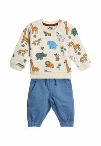 Felpa in cotone con stampa animale beige, abbinata a pantaloni della tuta blu con coulisse. Presenta maniche lunghe e polsini elasticizzati.