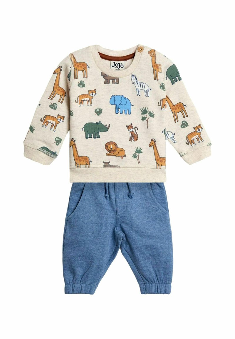 Felpa in cotone con stampa animale beige, abbinata a pantaloni della tuta blu con coulisse. Presenta maniche lunghe e polsini elasticizzati.
